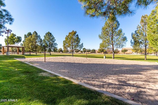 view of community featuring volleyball court, a gazebo, and a yard