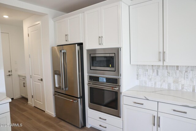 kitchen with pendant lighting, a center island with sink, sink, and light hardwood / wood-style floors