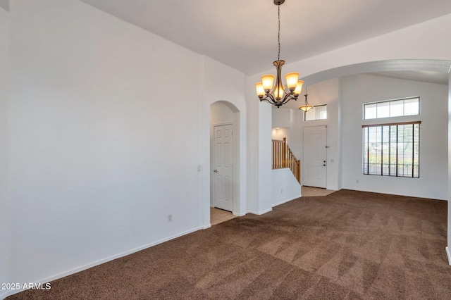 3900 S Velero St, Chandler, AZ 85249 - empty room with carpet floors, arched walkways, stairs, and a chandelier