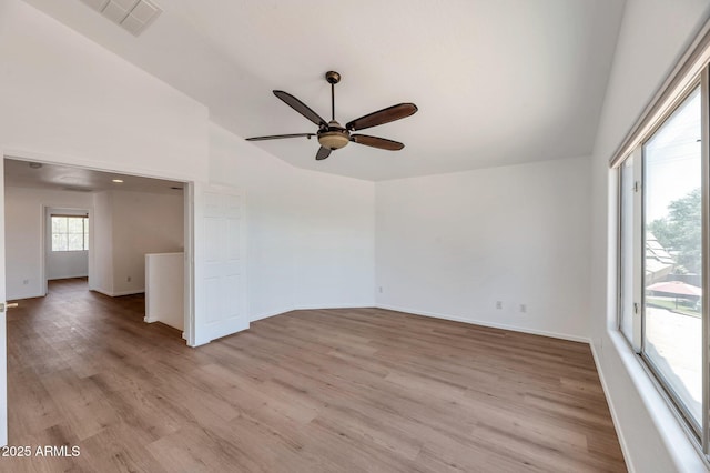 3900 S Velero St, Chandler, AZ 85249 - empty room featuring visible vents, light wood-style flooring, a ceiling fan, baseboards, and vaulted ceiling