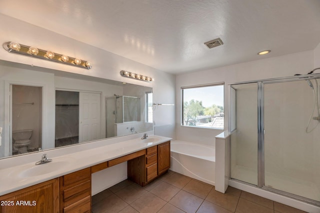 3900 S Velero St, Chandler, AZ 85249 - bathroom with a sink, tile patterned floors, visible vents, a garden tub, and a stall shower
