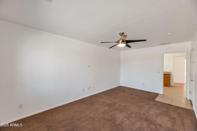 3900 S Velero St, Chandler, AZ 85249 - unfurnished room with visible vents, a ceiling fan, baseboards, and light carpet