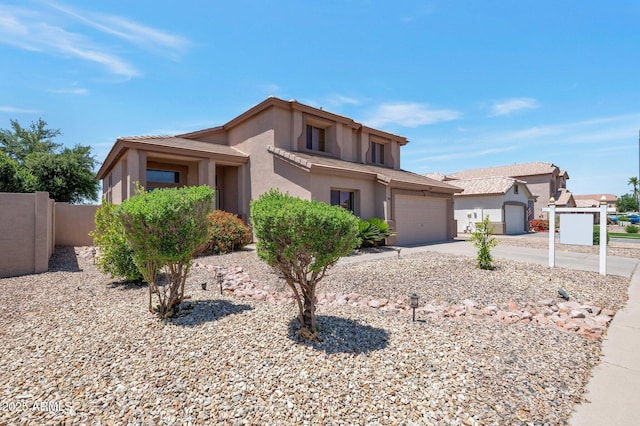 3900 S Velero St, Chandler, AZ 85249 - view of front facade with a garage, fence, stucco siding, and concrete driveway