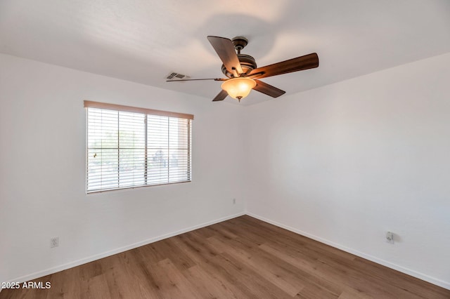 3900 S Velero St, Chandler, AZ 85249 - unfurnished room featuring a ceiling fan, baseboards, and wood finished floors