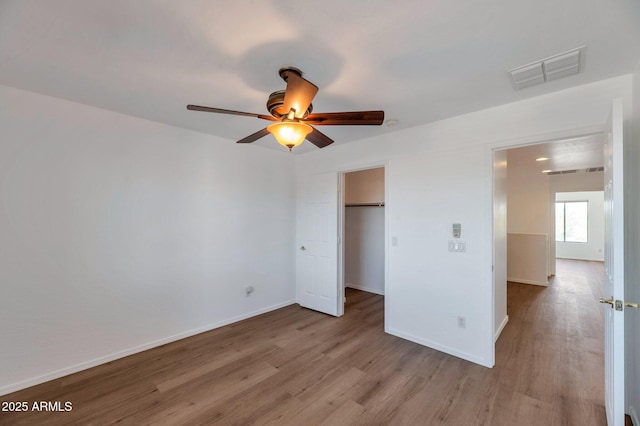3900 S Velero St, Chandler, AZ 85249 - unfurnished bedroom with visible vents, a closet, wood finished floors, baseboards, and ceiling fan