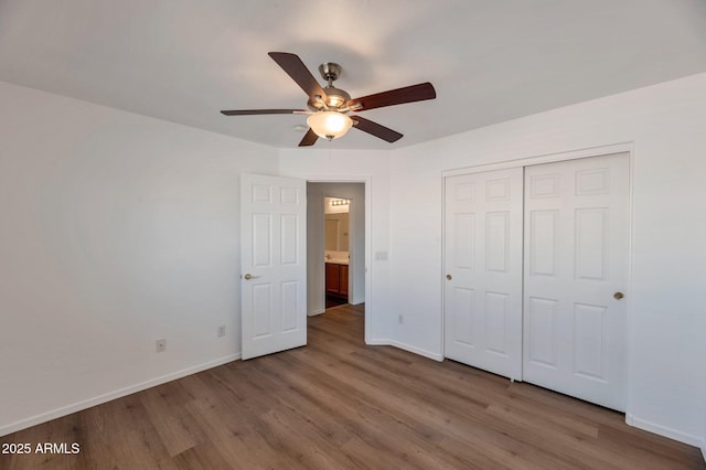 3900 S Velero St, Chandler, AZ 85249 - unfurnished bedroom with baseboards, a ceiling fan, a closet, and wood finished floors