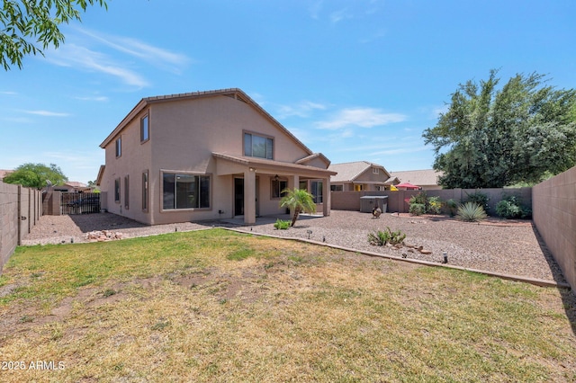 3900 S Velero St, Chandler, AZ 85249 - back of property featuring a lawn, a patio, a fenced backyard, and stucco siding