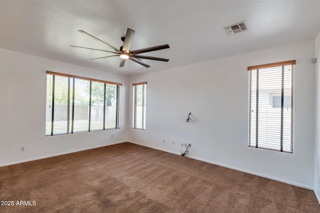 3900 S Velero St, Chandler, AZ 85249 - unfurnished room with plenty of natural light, baseboards, ceiling fan, and dark carpet