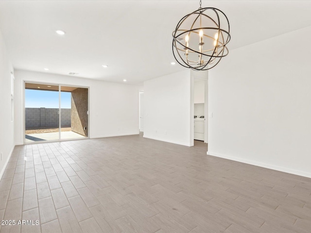 5537 S 246th Ave, Buckeye, AZ 85326 - spare room with recessed lighting, a chandelier, and wood finished floors