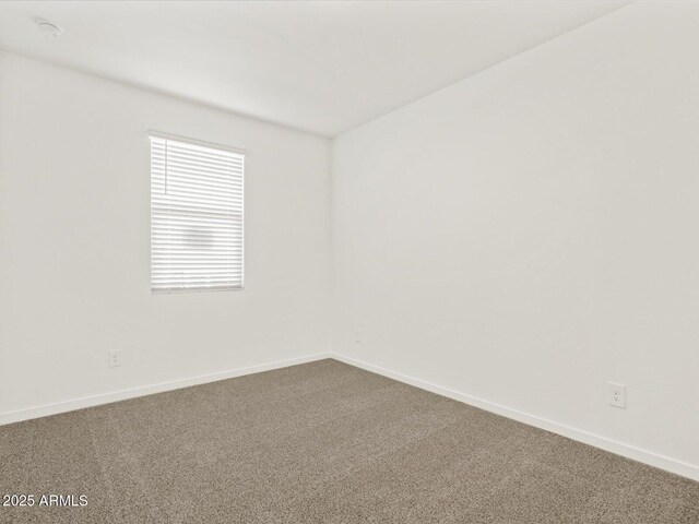 5537 S 246th Ave, Buckeye, AZ 85326 - unfurnished room featuring dark colored carpet