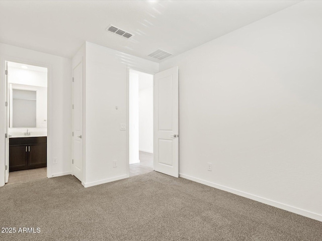 5537 S 246th Ave, Buckeye, AZ 85326 - unfurnished bedroom with light colored carpet and ensuite bath