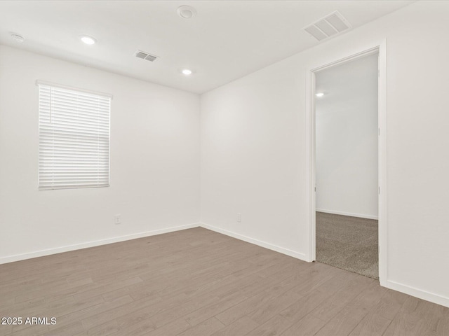 5537 S 246th Ave, Buckeye, AZ 85326 - empty room featuring light wood-style flooring and recessed lighting