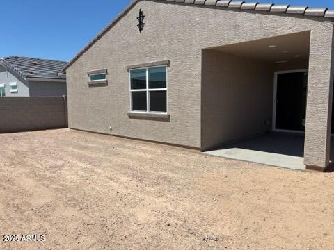 5537 S 246th Ave, Buckeye, AZ 85326 - rear view of house with a patio and stucco siding