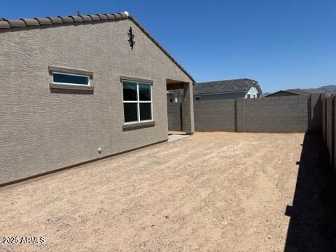 5537 S 246th Ave, Buckeye, AZ 85326 - rear view of house featuring a fenced backyard and stucco siding