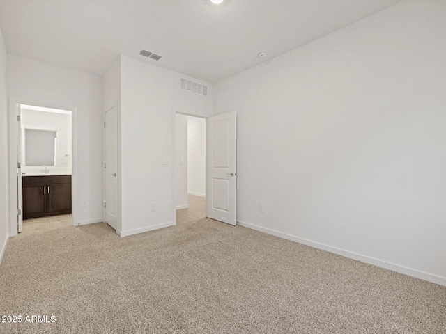 5537 S 246th Ave, Buckeye, AZ 85326 - unfurnished bedroom featuring light colored carpet and connected bathroom