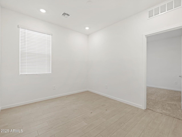 5537 S 246th Ave, Buckeye, AZ 85326 - unfurnished room featuring light wood-style floors and recessed lighting