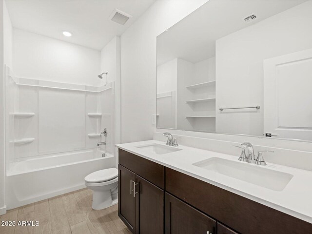 5537 S 246th Ave, Buckeye, AZ 85326 - full bath featuring double vanity, shower / bath combination, recessed lighting, and wood finished floors
