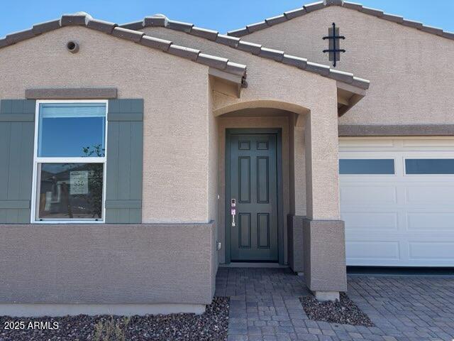 5537 S 246th Ave, Buckeye, AZ 85326 - entrance to property featuring stucco siding and an attached garage