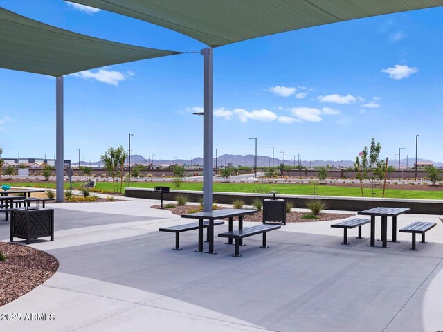 5537 S 246th Ave, Buckeye, AZ 85326 - view of home's community featuring a mountain view, a patio, and a residential view