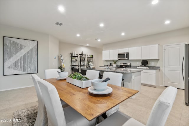 dining space with recessed lighting, visible vents, and light tile patterned floors