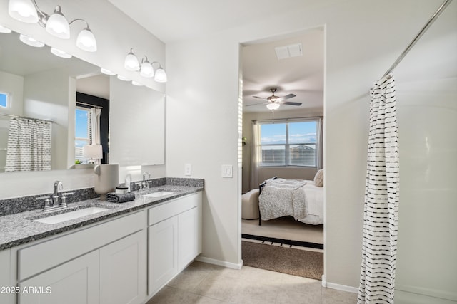 full bath with a ceiling fan, visible vents, a sink, and double vanity