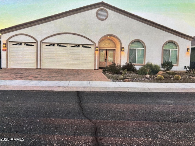 view of front of property with a garage