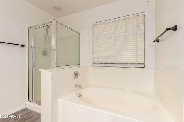3444 E Flamingo Ct, Gilbert, AZ 85297 - bathroom featuring a bath, a stall shower, and wood finished floors