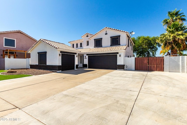 3444 E Flamingo Ct, Gilbert, AZ 85297 - mediterranean / spanish-style home with a gate, stucco siding, a tile roof, and driveway