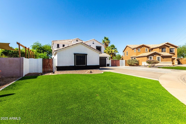 3444 E Flamingo Ct, Gilbert, AZ 85297 - view of front of property with concrete driveway, a tile roof, a gate, stucco siding, and an attached garage