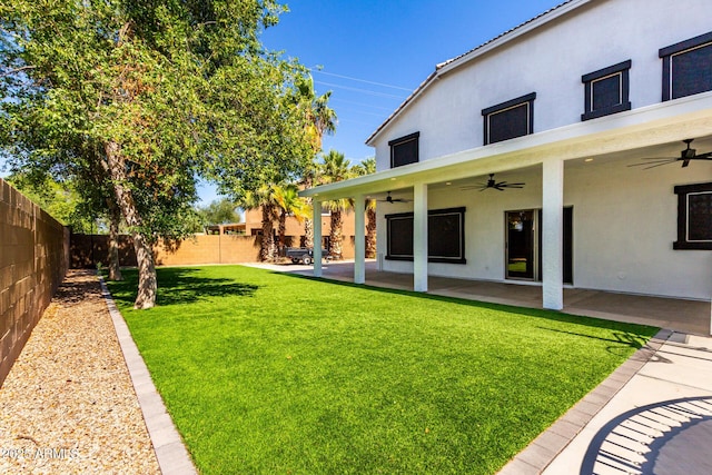 3444 E Flamingo Ct, Gilbert, AZ 85297 - fenced backyard with a ceiling fan and a patio area