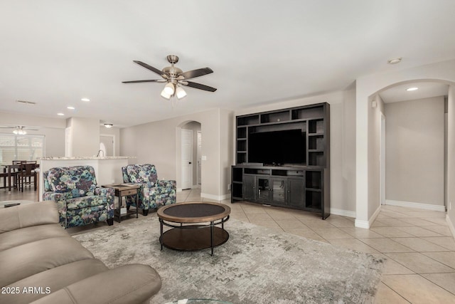 16219 W Yucatan Dr, Surprise, AZ 85379 - tiled living area featuring arched walkways, a ceiling fan, baseboards, and recessed lighting