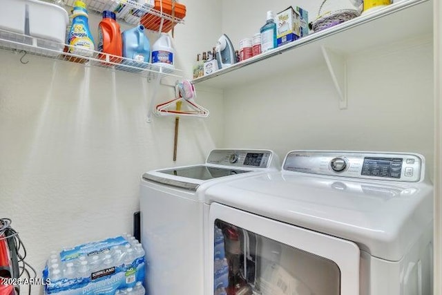 washroom featuring washing machine and dryer