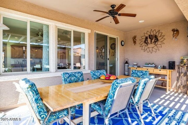 view of patio featuring ceiling fan