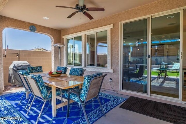 view of patio featuring ceiling fan