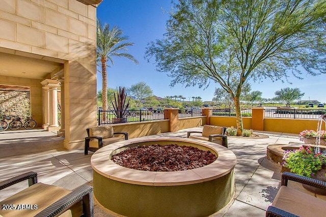 view of patio with an outdoor fire pit