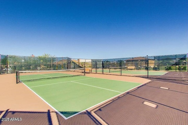 view of tennis court featuring basketball court