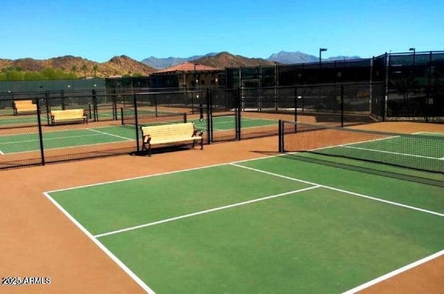 view of sport court with a mountain view and basketball court