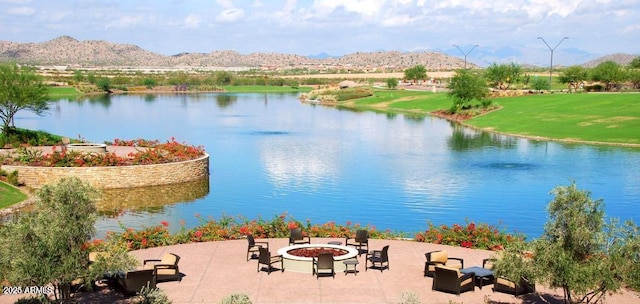 water view featuring a fire pit and a mountain view