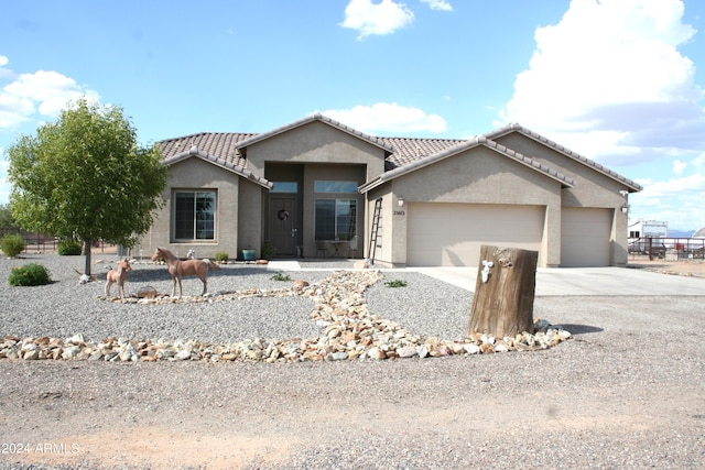 ranch-style house featuring a garage