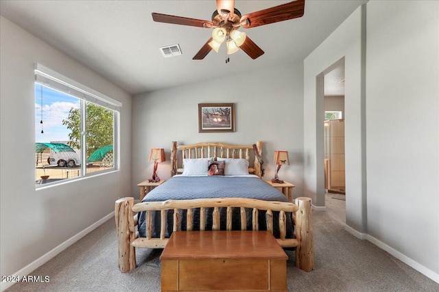 bedroom with light carpet, vaulted ceiling, and ceiling fan