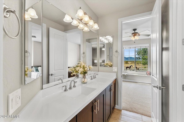 bathroom featuring ceiling fan, vanity, and hardwood / wood-style flooring