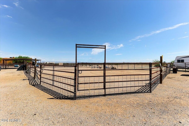 view of outdoor structure with a rural view