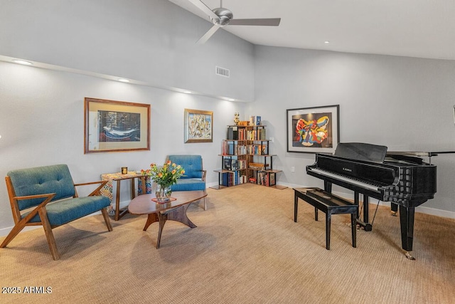 sitting room featuring light carpet, baseboards, visible vents, and a ceiling fan