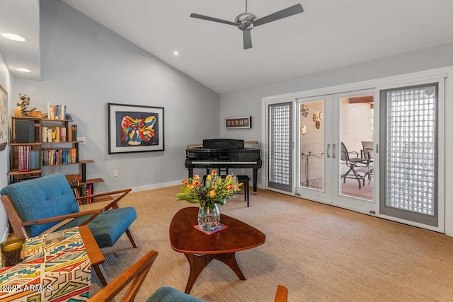 living area with vaulted ceiling, french doors, carpet, and a healthy amount of sunlight