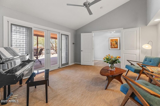 sitting room with french doors, carpet flooring, ceiling fan, high vaulted ceiling, and baseboards