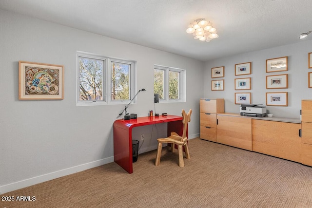 office space featuring light colored carpet and baseboards