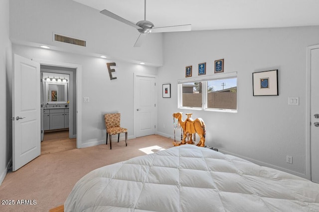 bedroom with light carpet, high vaulted ceiling, baseboards, and visible vents