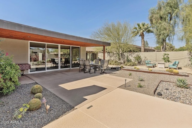 view of patio / terrace featuring fence and outdoor dining space