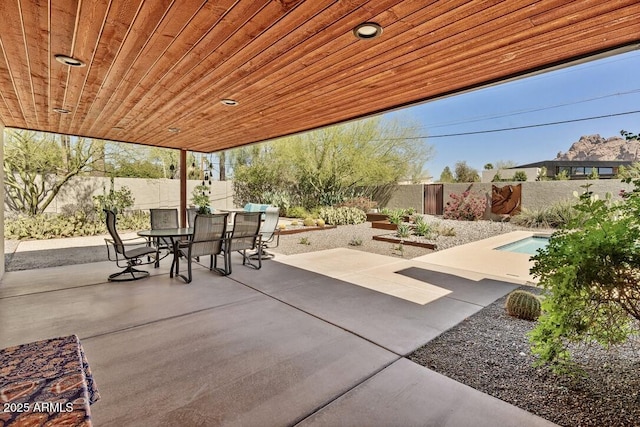 view of patio / terrace featuring outdoor dining space and a fenced backyard