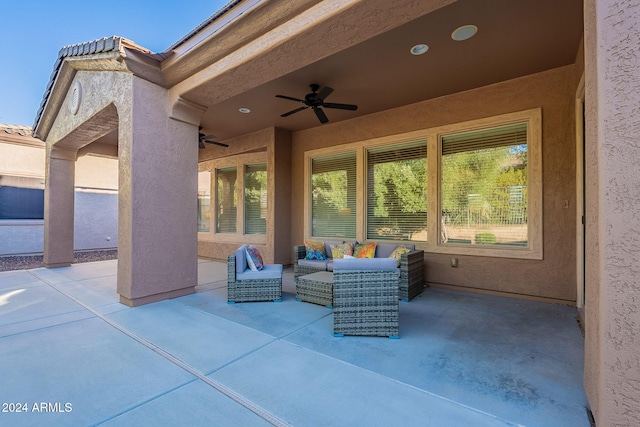 view of patio with ceiling fan and an outdoor living space